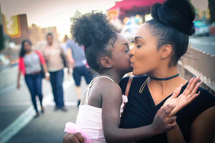 Mother Daughter Kiss