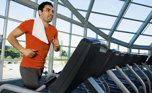 man in red shirt on treadmill